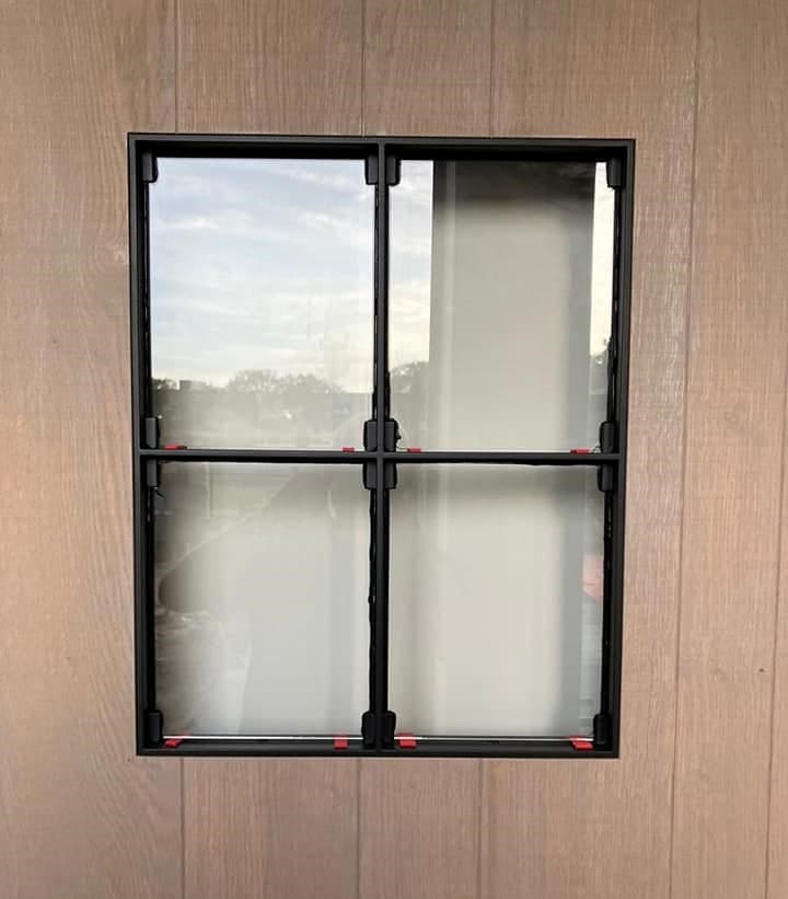 Double-pane steel-frame window before sealant application