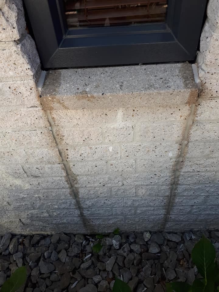 The exposed concrete joints in the wall have been sealed