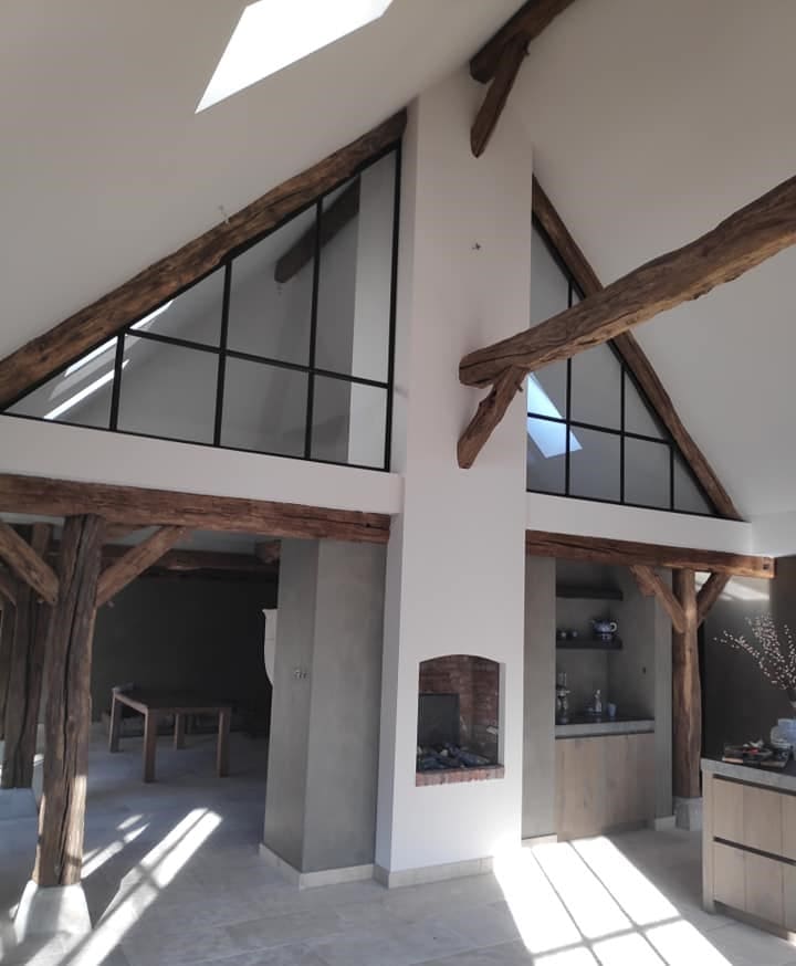 Triangular glass application for inside of pitched roof