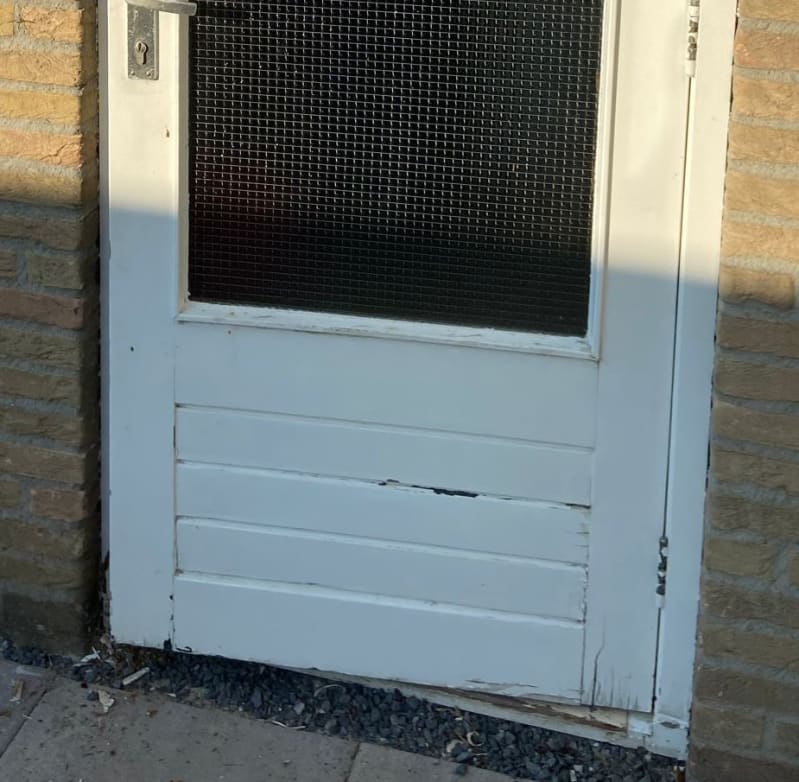 Decayed parts have been removed from the door, sealant applied and painted over to give a new, polished look
